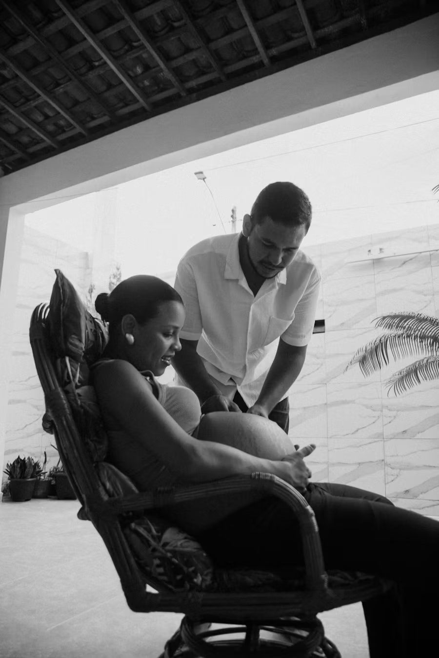 Pregnant client in a supported seated position during a prenatal massage session